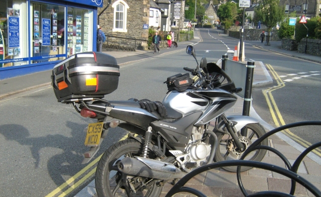 my silver cbf 125 on the footpath at windermere in the lake district